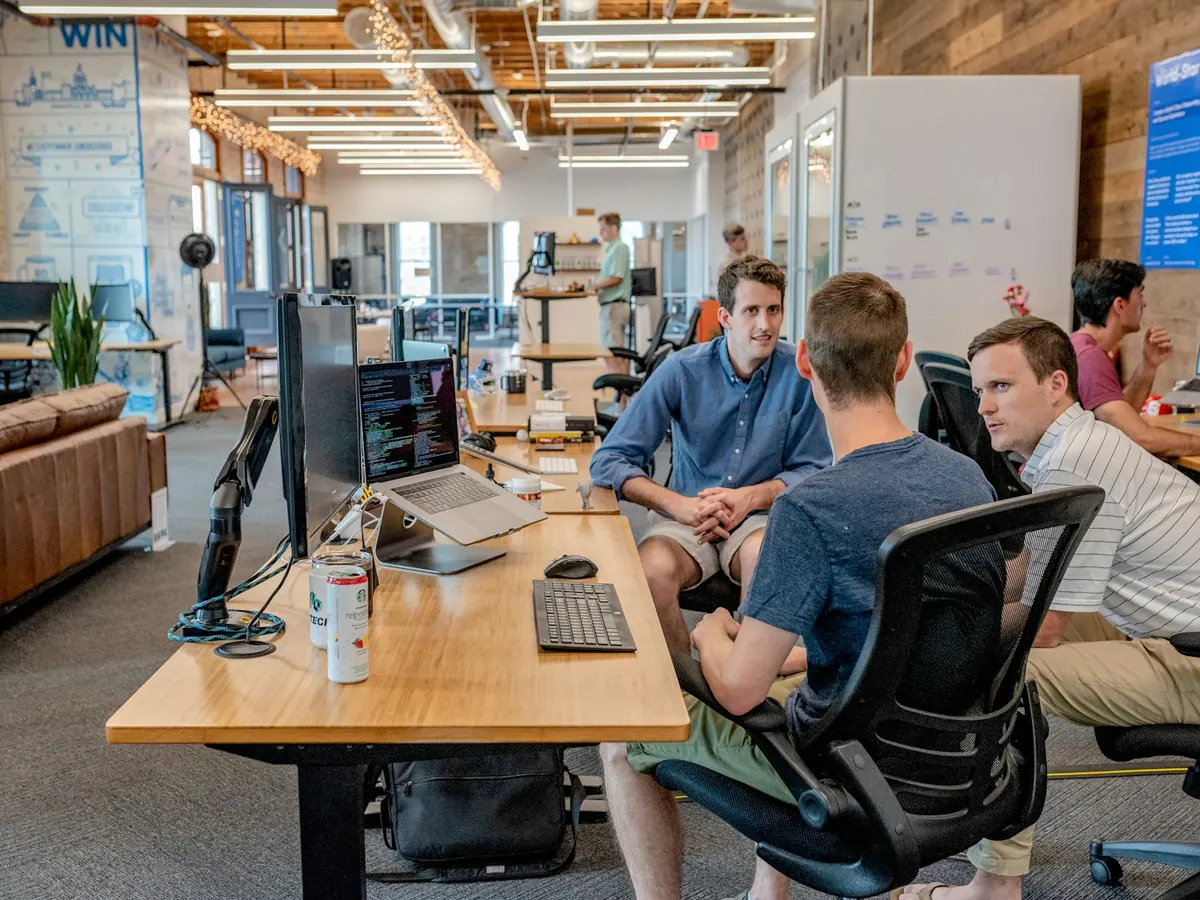 Professional colleagues collaborating closely in a modern office